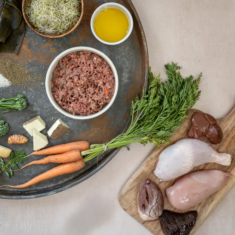 Grain free chicken raw dog food with premium meat, bone and offal with fresh seasonal vegetables and botanicals. 